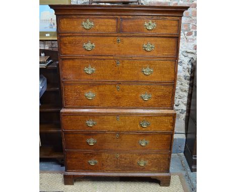 An 18th century oak chest on chest with two short over six long graduated drawers on shaped bracket feet, 106 cm x 56 cm x 16