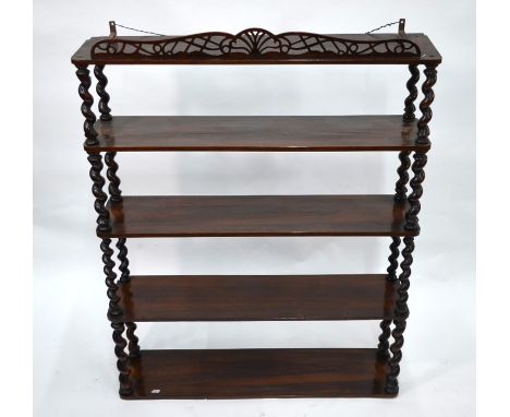 A Victorian rosewood wall shelf, the four tiers united by barley twist supports beneath a fret-cut pediment, 80 x 20 x 103 cm