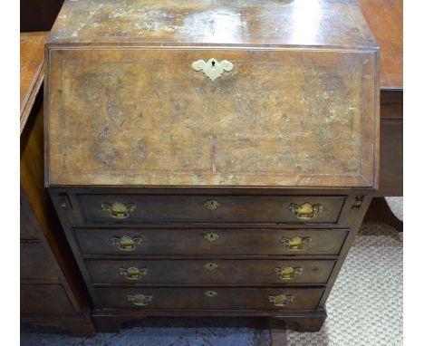 An 18th century walnut bureau with fitted interior over four long graduated drawers, raised on shaped bracket feet 76 cm w x 