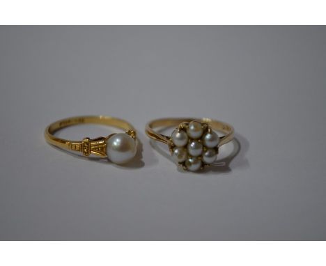 A single cultured pearl ring, set yellow metal stamped 18ct gold, with carved shoulders, size P to/w a a seed pearl cluster r