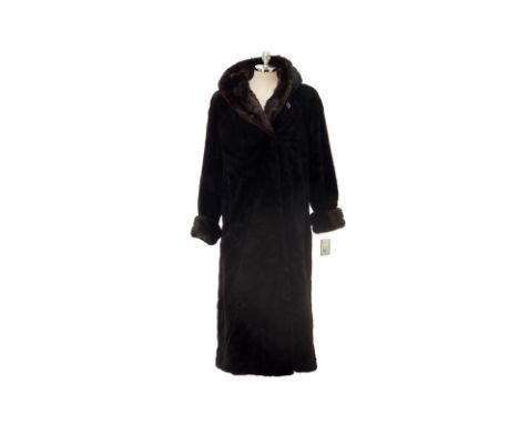 From a private Singaporean collection
Black faux fur hooded coat, with extra button, size M
Gallery New York
Condition: In ex