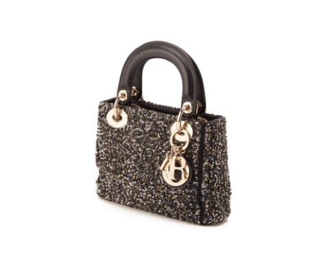 From a private Singaporean collection
Black leather Mini Lady Dior, embellished with back and gold sequins, with Dior dust ba