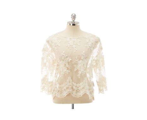 From a private Singaporean collection
Off white embroidered lace long sleeved top with silver button detailing to the back, w