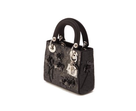 From a private Singaporean collection
Black satin Mini Lady Dior embellished with black sequins &amp; flowers, with Dior dust