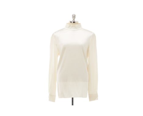 From a private Singaporean collection
Off white silk blouse with Cameo buttons to the cuffs, stand up collar, zip to the back