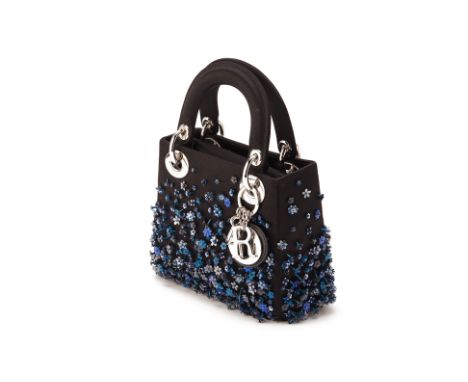 From a private Singaporean collection
Quilted black satin Mini Lady Dior, embellished with blue sequin flowers, with Dior dus