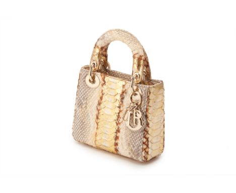 From a private Singaporean collection
White and gold python skin Mini Lady Dior, with Dior dust bag, authenticity card, detac