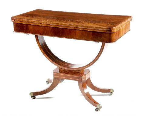 An early 19th century mahogany card table, the crossbanded hinged and swivel fold-over top with a baize lined surface, the ba