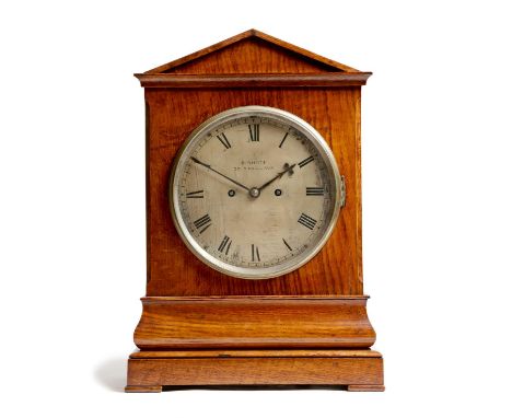 A Victorian oak mantel clock, the eight day twin train movement striking on a gong, with a silvered dial, with Roman numerals