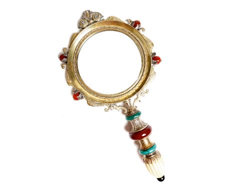 λ A Renaissance revival gilt and silvered metal magnifying glass, the circular glass within a beaded and moulded frame, decor