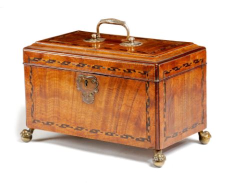 A George II oak tea caddy, inlaid with parquetry stringing and with moulded edges, the hinged lid with a leaf cast, silver co