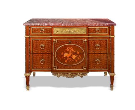 A Louis XVI style commode after Jean-Henri Riesener, with ormolu mounts, the rouge marble top with a moulded edge, above thre