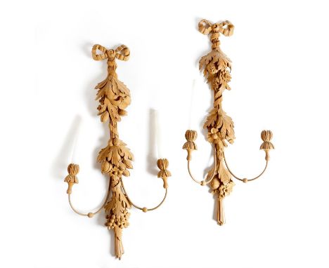 A pair of 18th century style carved wood twin-light wall appliques, each with a ribbon tied garland of fruit, flowers and lea