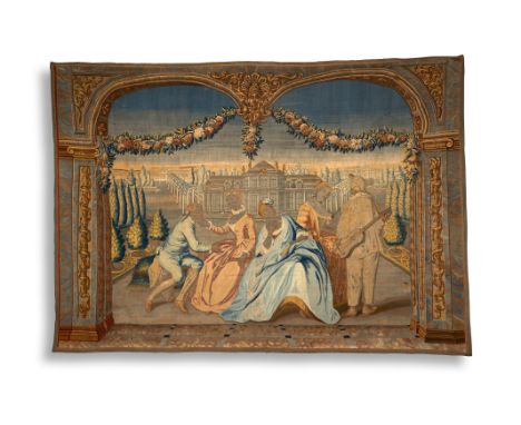 A mid-18th century Brussels tapestry in Rococo style, worked with a gentleman and three ladies wearing silk dresses, one with