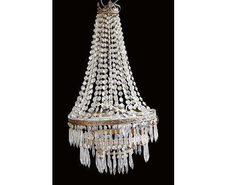 A Regency style gilt brass seven-light basket chandelier, decorated with palmettes and hung with graduated cut glass drops an