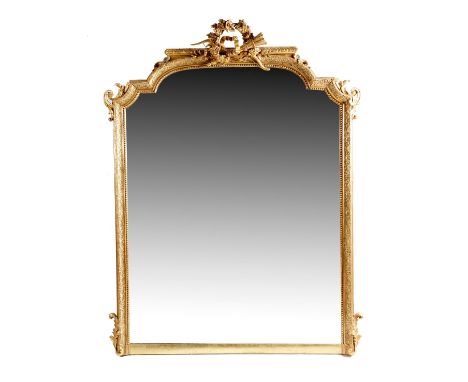 A late 19th century French gilt and composition overmantel mirror, with an arched plate within a beaded slip and a leaf scrol