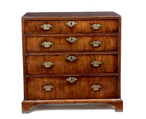 A George II walnut chest, cross and feather banded, the top with a caddy moulded edge, above four long graduated drawers, 76.