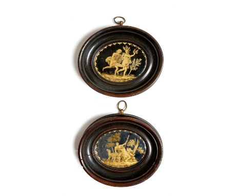 A pair of Italian verre églomisé pictures, decorated in gilt on a dark blue ground, one depicting Apollo chasing Daphne, the 
