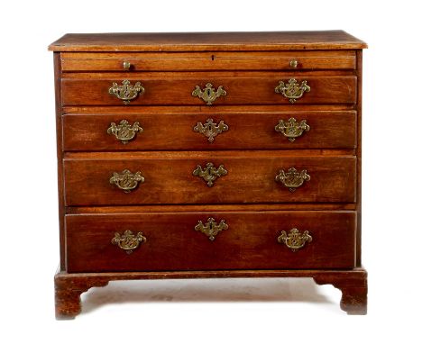 A George II mahogany bachelor's chest, the top with a caddy moulded edge above an unusual pull-out slide fitted with a pair o