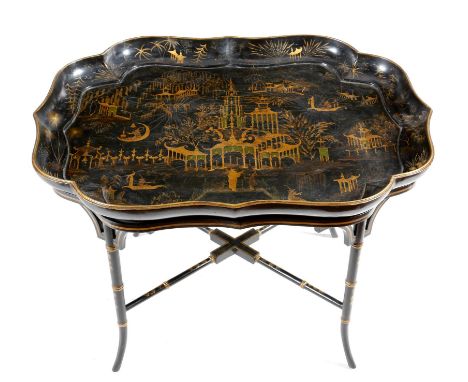 A William IV papier-mâché tray, of serpentine outline, decorated with gilt with chinoiserie scenes, including figures, pagoda