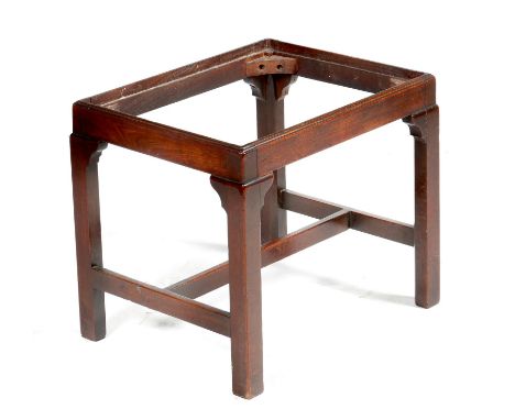 A George III mahogany stool, with chamfered legs united by an 'H' stretcher (lacking seat), 43.6cm high, 50.4cm wide, 40.3cm 
