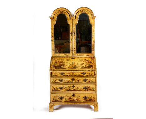 An early 18th century style japanned bureau bookcase, all over decorated with chinoiserie, including figures, flowers, pagoda