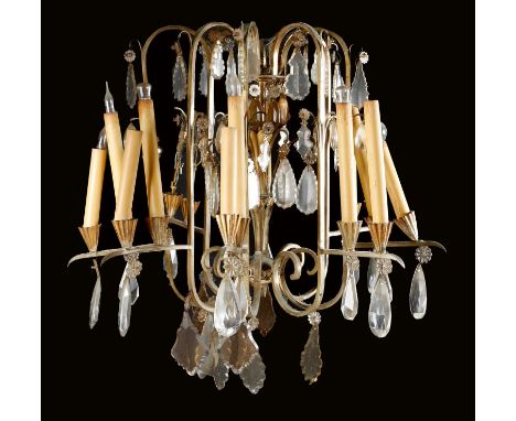 A gilt metal sixteen-light chandelier, of open form, hung with glass pendants, 71cm high, 71.5cm wide.