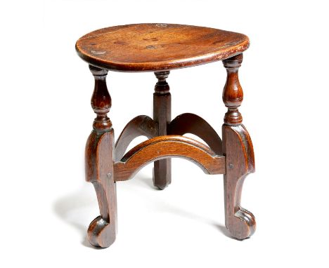An unusual oak stool, the circular top on turned tripod 'horsebone' type legs, united by moulded stretchers, possibly 17th ce