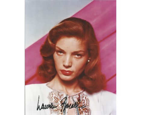 Lauren Bacall signed 10 x 8 colour portrait photo. Good Condition. All autographed items are genuine hand signed and come wit