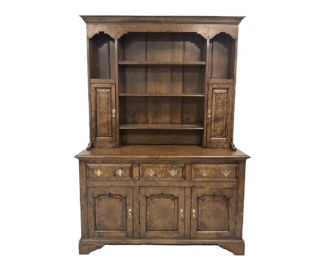 18th century style pollard oak dresser, the three height plate rack with projecting cornice over shaped apron, two open shelv