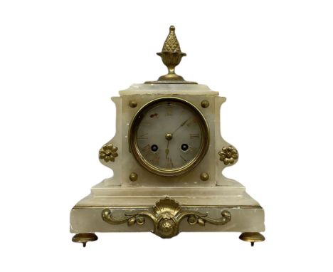 A 19th century French mantle clock in an alabaster case with cast brass mounts and pineapple finial, conforming alabaster dia
