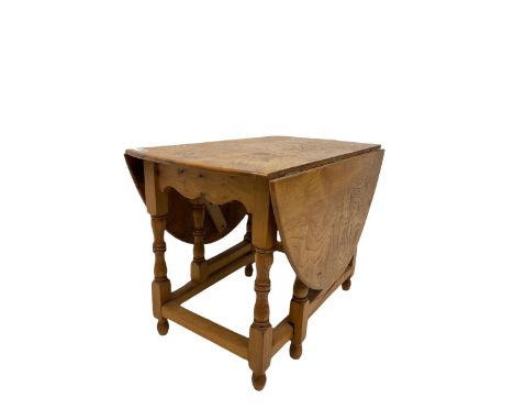 Pollard oak gate leg table by - D Shackleton of Snainton, the drop leaf oval top over gate leg action, raised on turned and s