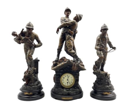 An imposing French spelter clock garniture displaying the patriotic feats of  a team of French firefighters c1910, with an ei