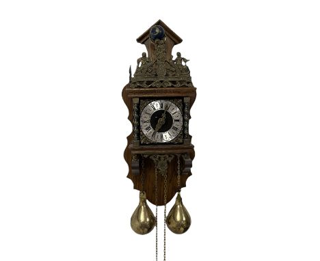 20th century Dutch style Zaanse Zaandam wall clock with a German eight-day weight driven movement housed in a wooden case on 