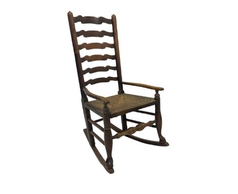 19th century country elm rocking chair, ladder back over rush seat, turned supports