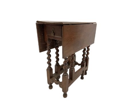 19th century elm gate leg table, the drop leaf top and one frieze drawer, over gate leg action, raised on spiral turned squar