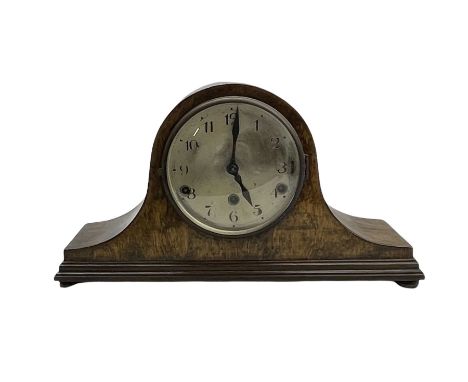 A 1930's oak cased three train Westminster chime mantle clock in an tambour case, with a silvered dial, Arabic numerals and m