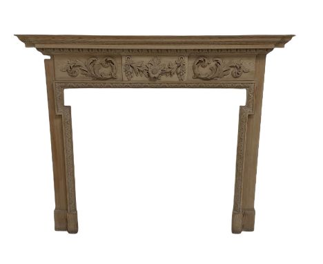 Pine fire surround, the mantel shelf over floral carving