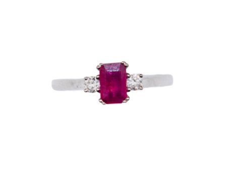 British Contemporary A small emerald cut ruby and diamond three stone ring Mounted in white gold  Ring size:L 1/2 