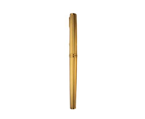 British Circa 1990 A Parker France rolled gold engine-turned fountain pen With 18 carat gold nib and black onyx terminals