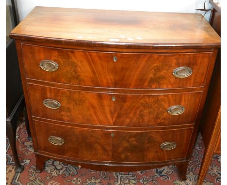 A George III mahogany bow front chest of drawers, crossbanded top, three flame mahogany fronted graduated cockbeaded drawers,