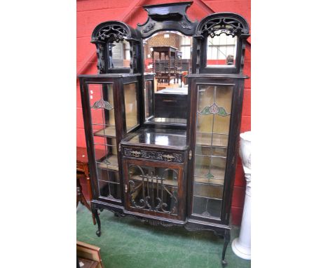 An Aesthetic Movement mirror back display cabinet, three bevel edge mirrors, recesses and shelving to top, single drawer over