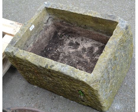 A stone trough. 35cm high x 60cm long x 43cm wide.