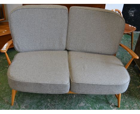 An Ercol two seat settee 