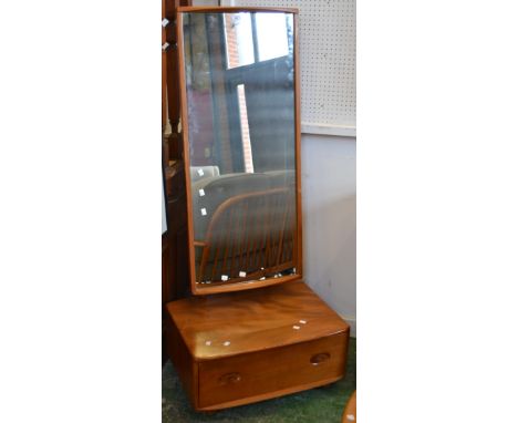 An Ercol cheval mirror, deep drawer to base 