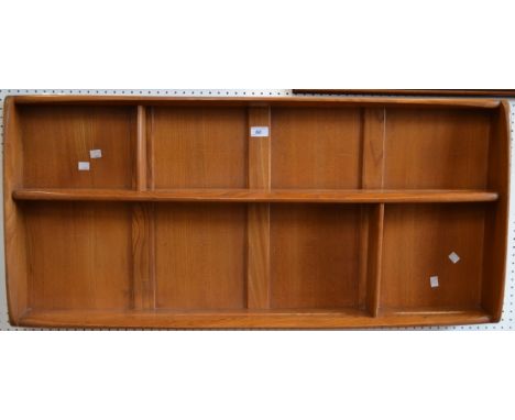 An Ercol wall mounted plate rack 