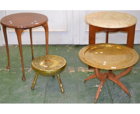 A Middle eastern brass tray top collapsible table; an Iranian chased brass stool; a mahogany occasional table; an onyx topped