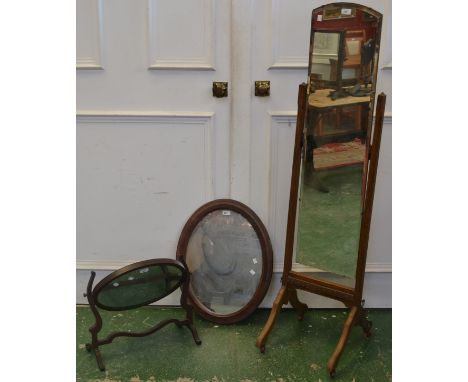 A George III  style dressing mirror; an oak cheval; an oval wall mirror (3)