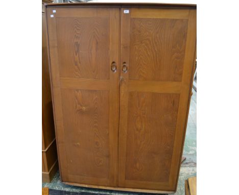 An Ercol gentleman's fitted wardrobe 