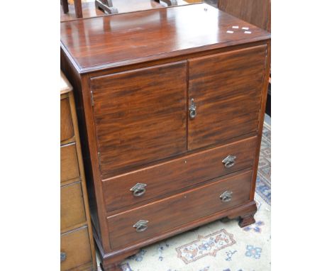 A mahogany tallboy, moulded top over two door cupboard and two long drawers, bracket feet